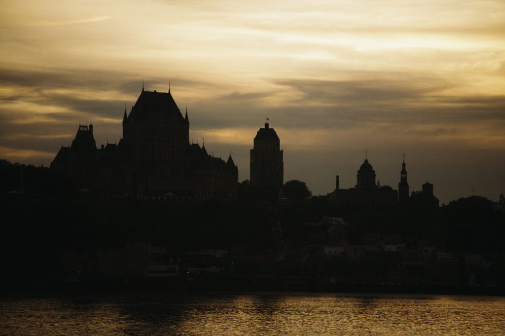 A silhouette of old Quebec City skyline at twilight.