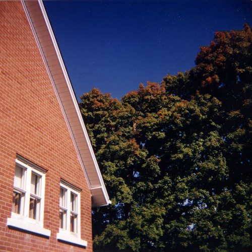 A red brick building and some trees.
