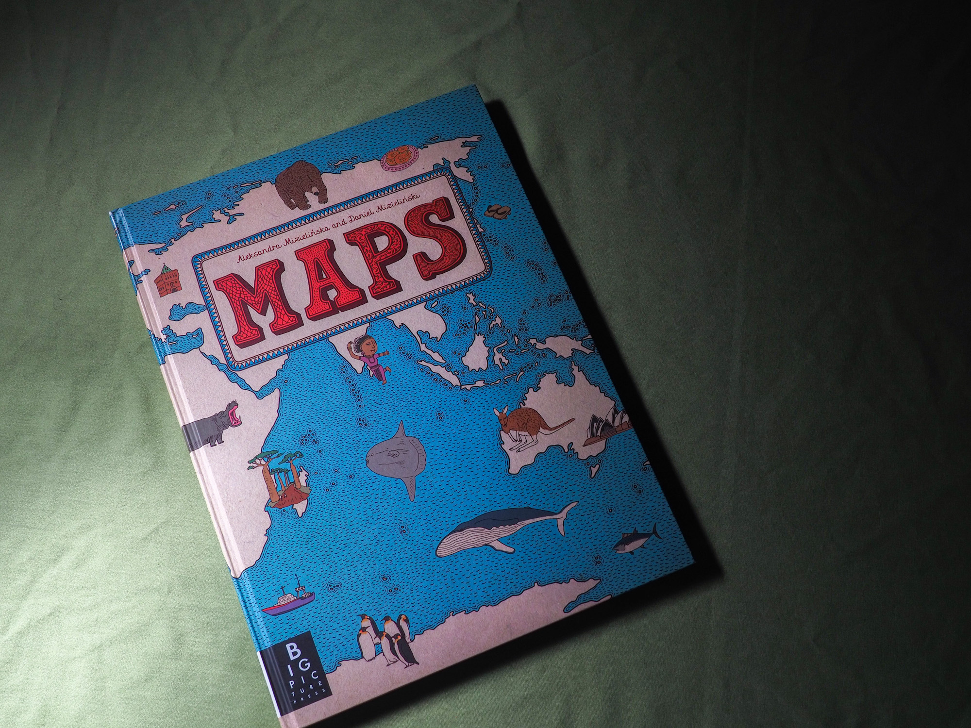 A book titled 'Maps'