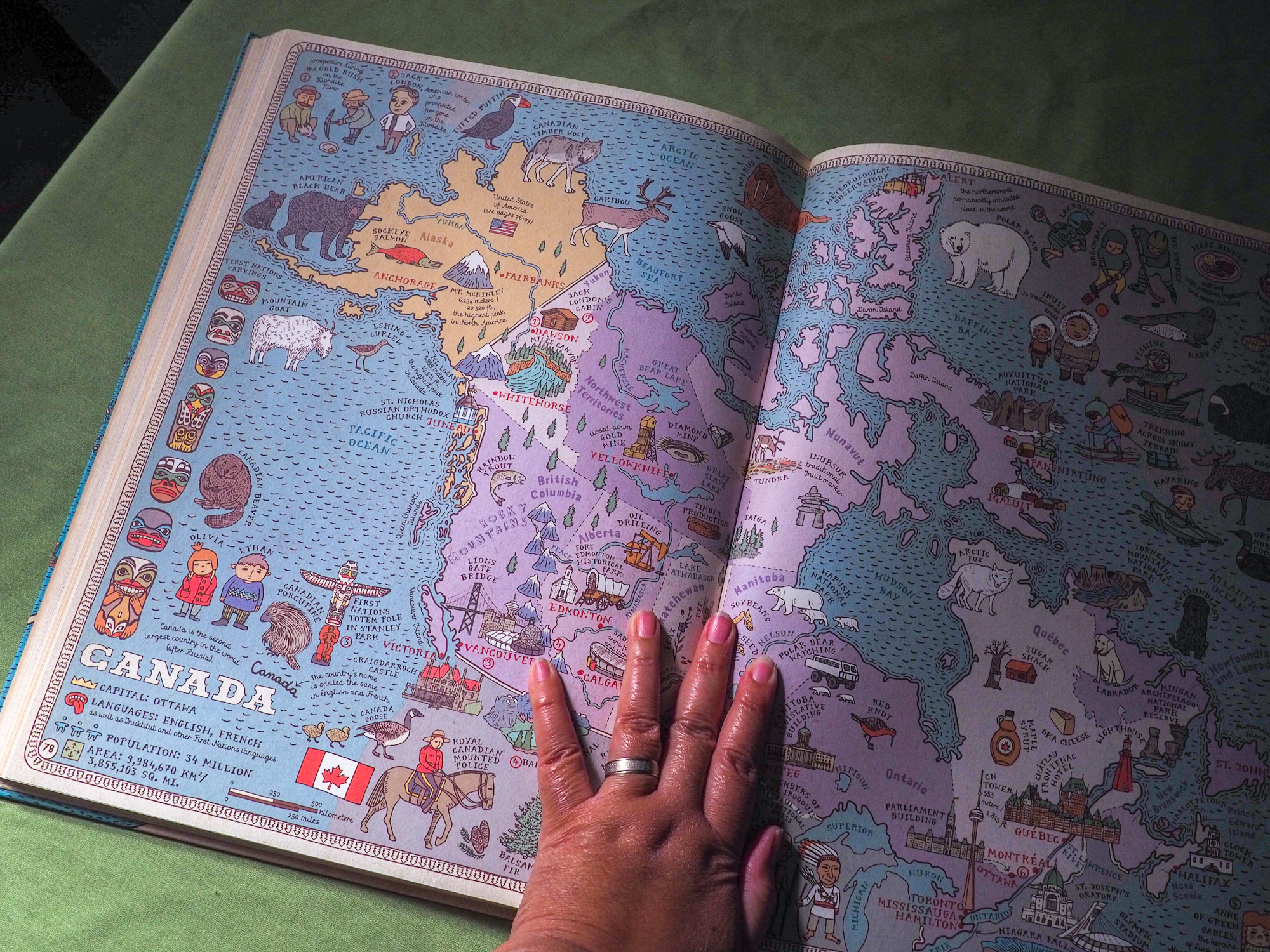 A spread of a cartoony map of Canada.